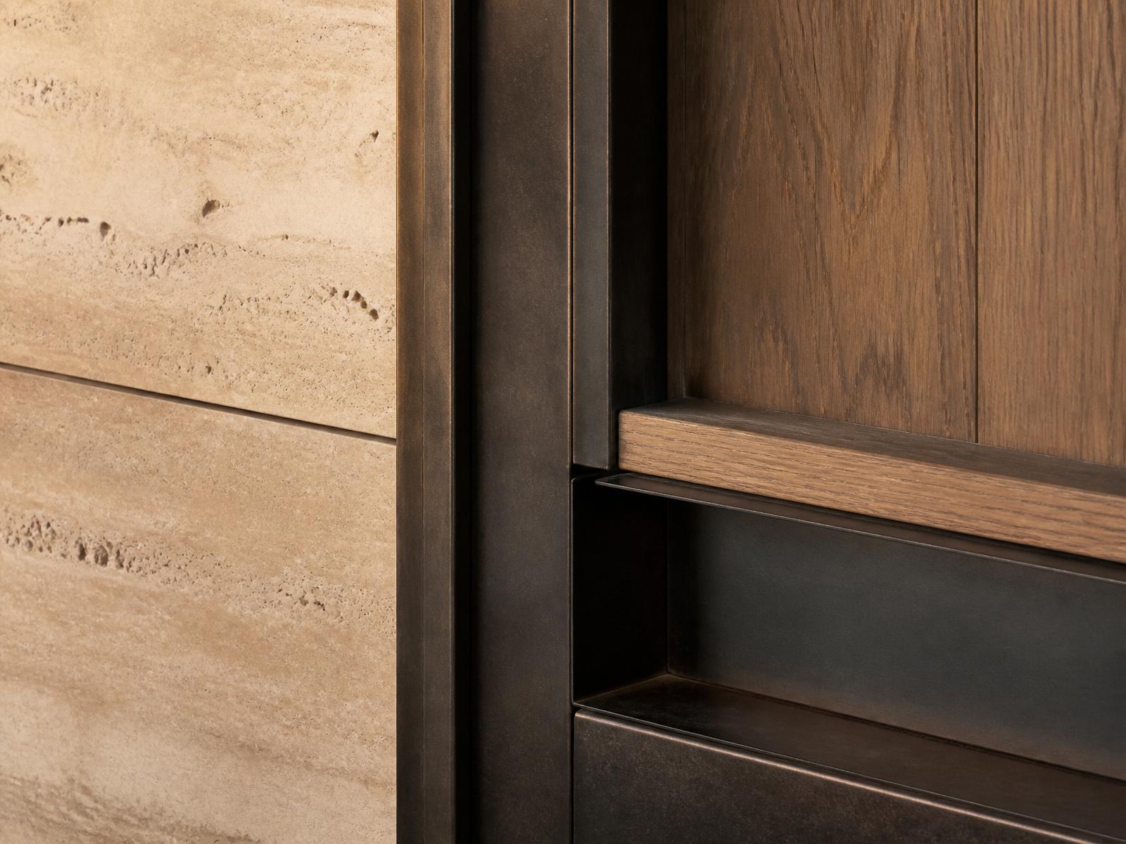 Travertine and blackened bronze detail